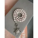 Колье из розового кварца в ювелирной огранке, с серебристой подвеской солнце