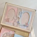 Два фотоальбома для мальчика и девочки. Две фоторамки на крышке коробки.