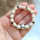Женский браслет-талисман из молочного говлита