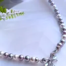 Колье-чокер из жемчуга с замочком бантиком.