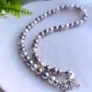 Колье-чокер из жемчуга с замочком бантиком.